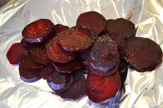 sliced beets sitting on top of aluminum foil