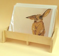 a card holder with a painting of a rabbit on it