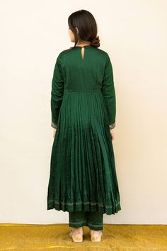 Green silk chanderi anarkali with zardosi hand embroidered neckline, yoke and cuffs. Comes with pant and a kota tissue dupatta.
Components: 3
Pattern: Hand embroidered
Type Of Work: Zardosi
Neckline: Round
Sleeve Type: Full
Fabric: Silk chanderi, Dupatta : Kota tissue, Lining : Mulmul
Color: Green
Other Details: 
Embroidered dupatta
Closure : Back button
Disclaimer : The natural imperfection and textures in the weaves are the outcome of handloom fabrics (not to be considered as defect)
Occasion: Designer Cotton Silk Gown With Zari Work, Transitional Raw Silk Anarkali Gown, Transitional Anarkali Gown In Raw Silk, Raw Silk Anarkali Set With Zari Work, Maxi Length, Anarkali Gown In Raw Silk With Chandbali Shape, Maxi Length Raw Silk Anarkali Set With Zari Work, Anarkali Raw Silk Long Sleeve Gown, Anarkali Chanderi Gown With Gota Work, Long Sleeve Chanderi Anarkali Set With Dori Work