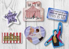 the greatest showman magnets are displayed on a white wooden surface with stars and stripes