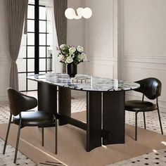 a dining room table with chairs around it