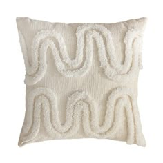 a white pillow with an embroidered design on the front and back, made out of yarn