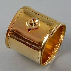 Features: - 100% Authentic MOSCHINO. - Square shirt button cuff novelty bracelet. - Gold tone hardware. - Signed MOSCHINO. - Excellent vintage condition. Measurements:  Height: 2.60 inches (6.6 cm) Wearable Length: 8.27 inches (21 cm)  ** This cuff bracelet will be shipped via DHL Express with tracking number. Please convo me for any queries and additional photos. Thank you for visiting. Other Fees that buyers need to know: Please make sure you know and understand the laws in your country. Buyer Luxury Wide Band Cuff Bracelet Gift, Luxury Wide Band Cuff Bracelet As Gift, Designer Polished Cuff Bracelet Gift, Designer Polished Cuff Bracelet As Gift, Designer Polished Finish Cuff Bracelet As Gift, Designer Gold Cuff Bracelet Gift, Designer Gold Cuff Bracelet As Gift, Square Shirt, Vintage Moschino