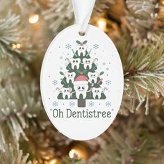 a christmas ornament hanging on a tree with the words oh dentistree