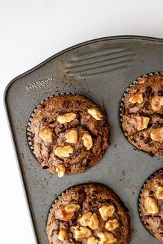 chocolate muffins with walnuts in a baking pan