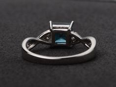 Welcome to my shop, you can find many beautiful gemstone jewelry here, and you also can ask for customized service. Main Stone: London blue topaz, princess cut, measures 6X6mm. Accent Stones: cz Metal: 925 sterling silver plated with rhodium. I also can provide metal options such as 14k solid yellow/white/rose gold Setting: prong setting more rings: https://www.etsy.com/shop/XCjewelryStudio?ref=hdr_shop_menu It's a perfect gift for the person who was born in November (Birthstone), it's quite com Princess Cut Topaz Birthstone Ring For Promise, Elegant Blue Topaz Princess Cut Jewelry, Elegant White Gold Princess Cut Topaz Ring, Elegant Princess Cut Blue Topaz Ring, Fine Jewelry Princess Cut Topaz Promise Ring, Elegant Princess Cut Topaz Ring With Cubic Zirconia, Elegant Princess Cut Topaz And Cubic Zirconia Ring, Princess Cut Topaz Ring With Center Stone For Promise, Princess Cut Blue Topaz Jewelry With Center Stone