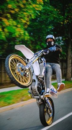 a man riding on the back of a motorcycle