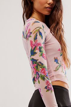 Effortlessly essential with a slight ethereal touch, this timeless top is featured in a fitted, long sleeve silhouette with stunning floral printing throughout, semi-sheer sleeves, and defined seaming for added dimension. **Fit:** Fitted, classic style **Features:** Scoop neckline, defined seaming, semi-sheer sleeves **Why We | Betty's Garden Top by Free People in Red, Size: XS Floral Printing, Fitted Long Sleeve, Chic Fall Outfits, Retro Tops, Mesh Shirt, Free People Clothing, Sheer Sleeves, Floral Shirt, Cool Tees