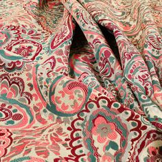 a red and blue paisley print fabric