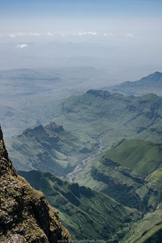 a view of mountains and valleys from the top of a mountain