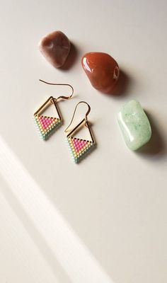 Sweet colors of sea glass teal, shimmering buttery yellow and striking hot pink are woven onto gold plated triangles and finished with 14k gold filled ear wires. Cakes Minimalist, Elegant Triangle Beaded Earrings Gift, Bead Earrings Triangle, Beaded Triangle Earrings, Gold Beaded Geometric Earrings, Triangle Beaded Earrings, Handwoven Earrings, Earrings Triangle, Seed Bead Crafts