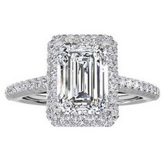 an emerald cut diamond engagement ring with double halos