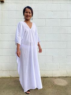 Unwind in absolute comfort with our semi sheer cotton gauze kaftan. This kaftan is perfect for the beach, pool, resort and laid-back time at home. Crafted from quality soft and breathable gauze cotton, it offers an airy fit that's ideal for lounging and cover up. Its relaxed design and easy slip-on style make it your go-to choice for outdoor cover up and relaxed nights at home. Oversized White Cover-up For Loungewear, Beachy V-neck Cover-up With Relaxed Fit, White Relaxed Fit Cover-up For Loungewear, Relaxed Fit Beach Dress, Long Relaxed Fit Beachwear Cover-up, Beachy V-neck Relaxed Fit Cover-up, White Relaxed Fit Beach Cover-up, White Oversized V-neck Kaftan, Summer Daywear Cover-up With Relaxed Fit