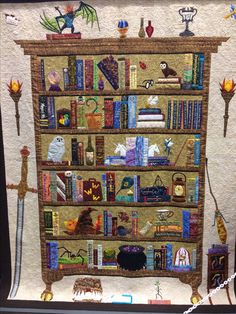 a quilted book shelf with many books on it