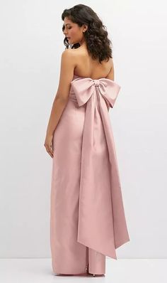 Shop this Complete the romantic vibe of an elegant wedding party with this strapless column maxi dress. A fitted silhouette flatters and accentuates curves, as a draped bodice creates a sleek detail. An oversized bow detail at the dress back captures the fashion-forward personality of this exquisite Satin Twill dress. Pink Dress With Bow On Back, Conceptual Style, Pantone Rose, Pantone Rose Quartz, Elegant Wedding Party, Pink Bow Dress, Twill Dress, Prom Inspo, Bridesmaid Dresses Strapless