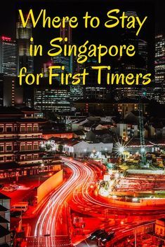 the city skyline at night with text where to stay in singapore for first timers