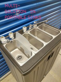 two sinks are shown in front of a blue wall