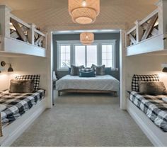 a bedroom with bunk beds and checkered pillows