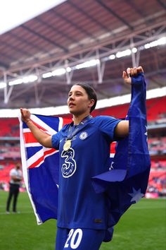 a woman holding a flag in her hands