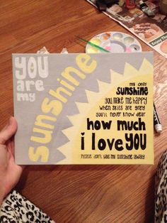 someone holding up a piece of paper that says, you are sunshine and how much i love you