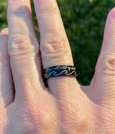 "This line of black stainless steel rings (sizes 5-11) is engraved with the quote \"It is well with my soul\" in a pretty script font. --Rings come in a small gift box. This style stainless steel ring is 3mm wide. I offer other stacking rings (stamped or engraved in silver, gold or rose gold) that can be worn with this ring as well. PLEASE be sure of your ring size before ordering. If you're interested in a different quote or name, please message me." Personalized Black Stainless Steel Rings, Black Stainless Steel Promise Ring, Black Stainless Steel Engraved Ring As Gift, Black Stainless Steel Engraved Ring For Gift, Black Stainless Steel Promise Jewelry, Black Engraved Ring For Promise, Black Engraved Promise Ring, Black Stainless Steel Engraved Ring, Personalized Black Engraved Ring For Anniversary