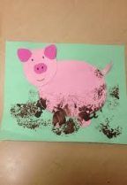 a pink pig painted on a green background