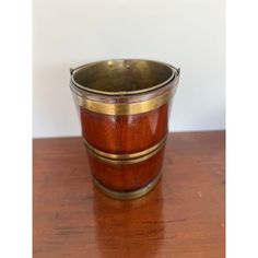 a wooden cup sitting on top of a table