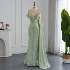 Stunning Mint Mermaid Luxury Evening Dress - Elegant Beaded One Shoulder Gown for Women's Party 2024 Evening Dress With Cape, Dress With Cape, Luxurious Dresses, Dubai Style, Dress With Shawl, Green Mermaid, One Shoulder Gown, Cape Sleeves, فستان سهرة