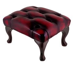 a red and black foot stool on white background