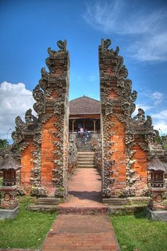 the entrance to an old building with stone carvings on it's walls and steps