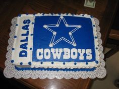 there is a cake that has been decorated with the name of the cowboys on it