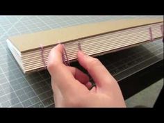 someone is making a book out of cardboard