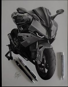 a drawing of a motorcycle is shown on the wall next to some pens and markers