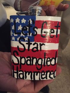 someone is holding up a flask with the words let's get star spangled hammered on it