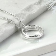 "Our beautiful Sterling Silver Secret Message Ring Necklace is the perfect way to give someone special a stunning necklace complete with a secret message they can carry with them everywhere. The necklace is available with either a luxurious polished finish or hammered finished ring. We can engrave the inside of these rings with your secret message. The ring comes one a fine belcher chain, available in five different lengths. So why not make this a truly personal gift by having your own special message engraved, by us To order this necklace simply select the chain length and the font you would like us to use from the drop down menus, you can select \"no engraving\" if you would like us to leave it blank. Then at the checkout, let us know which finish you would like, either polished or hamme Chains Aesthetic, Wedding Ring Necklaces, Special A, Engraved Items, Stunning Necklace, Sterling Silver Necklace, Cute Jewelry, Ring Necklace, Handmade Ring