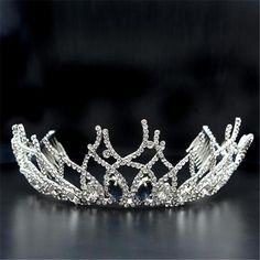 a tiara is shown on a black surface