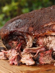 a roast beef sandwich cut in half on a cutting board