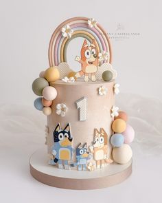 a cake decorated with cartoon characters and decorations