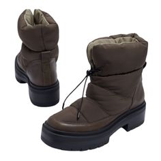 Meet Lakyn Your New Boot To Help You Battle Through The Colder Days Ahead Featuring A Puffy Upper And An Elastic Drawstring For Easy Closure. Pair This With Your Favorite Parka To Keep You Nice And Toasty! Lakyn Puffer Boot Closure: Adjustable/ Pull On Toe: Round Material: Leather/ Nylon Heel Height: 1.7" Boot Shaft: 6" Calf Circumference: 11.8" Brand New Without The Box Please See Pictures For Details Green Insulated Waterproof Boots With Round Toe, Casual Insulated Green Rain Boots, Winter Outdoor Slip-resistant Rain Boots, Insulated Slip-on Hiking Boots, Winter Hiking Boots, Green Non-slip Rain Boots For Outdoor, Black Leather Riding Boots, Leather Snow Boots, Alpine Green