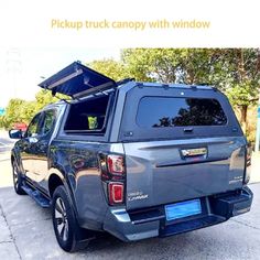 the back end of a pickup truck with an awning on it's roof