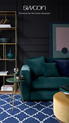 a living room filled with furniture and a blue rug on top of a wooden floor