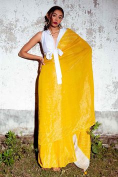 Yellow chanderi tissue saree with contrast diagonal striped bandhani pattern on border and mirror hand work highlights. Comes with unstitched blouse piece.
Components: 2
Pattern: Hand Embroidered
Type Of Work: Bandhani Pattern and Mirror Work
Fabric: Chander Tissue
Color: Yellow
Other Details: 
Drop tasselled pallu edges
Note: The stitched blouse worn by the model is not for sale
Occasion: Mehendi and Haldi,Sangeet - Aza Fashions Mirror Work Fabric, Mirror Hand Work, Bandhani Pattern, Bandhej Saree, Saree Fashion, Sleek Bun, Tissue Saree, Saree Blouse Designs Latest, Bandhani Saree