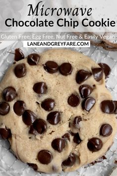 a chocolate chip cookie on top of aluminum foil with text overlay that reads microwave chocolate chip cookies