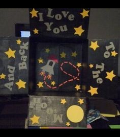 some kind of box that is decorated with stars and the words i love you to the moon and back