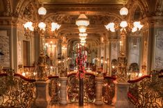 an ornately decorated room with chandeliers and candles