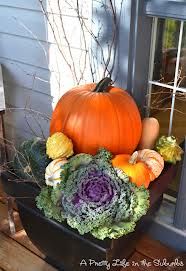 an image of a pumpkin and vegetables on a table in front of a window with the caption pin it