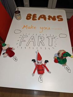 a sign that says beans make you faire with two elfs on it and the words, beans make you faire