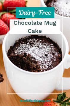 chocolate mug cake with powdered sugar on top and strawberries in the background text reads dairy - free chocolate mug cake