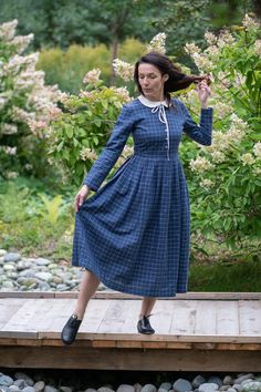 Linen Gingham Dress, Peter Pan Collar Dress, Amish Linen Dress❃   Your wardrobe should be versatile to suit all occasions and weathers! This blue plaid linen dress has been designed with that in mind, having a neat button-down top that's complemented by a full, pleated midi skirt (with pockets). The white Peter Pan collar and cuffs are detachable so you can vary your look from prim to party-ready!❃ Features•       Available in 40 colors•Handmade•Natural fabric - 100% linen•100% cotton fabric•Det Classic Gingham Dress, Classic Cotton Plaid Dress, Classic Plaid Cotton Dress, Fitted Plaid Midi Dress For Daywear, Puritan Dress, Collar Outfits, Dress Peter Pan Collar, Pan Collar Dress, Midi Skirt With Pockets