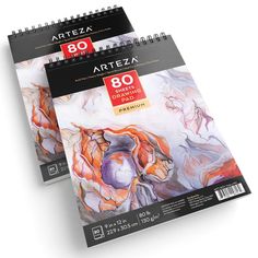 two spiral notebooks with artza designs on the front and back cover are shown